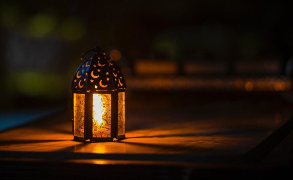 Lit lantern in the dark.