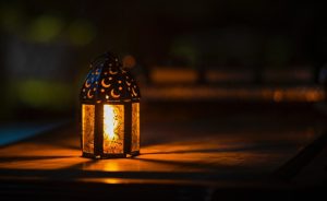 Lit lantern in the dark.