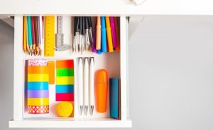 Open drawer with art supplies.