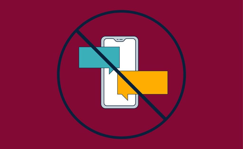 Prohibition sign over a phone with text messages.