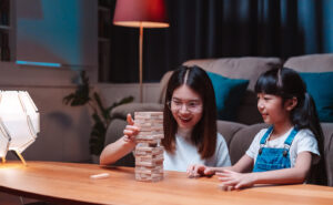 Two children playing a stackable game