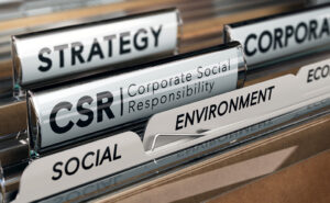 File folders with tabs labeled strategy, CSR, social, environment, and more