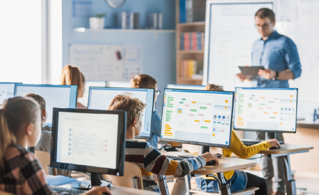 Image of a teacher implemented blended learning in their classroom with computers.