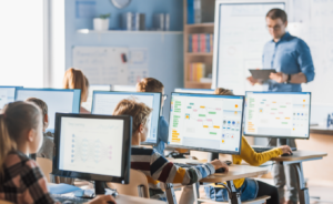 Image of a teacher implemented blended learning in their classroom with computers.